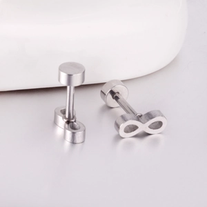 Macro view of infinity symbol stud earrings with smooth metallic finish and screw backs