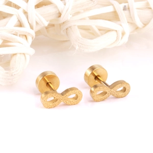 Macro view of gold infinity stud earrings with a refined frosted matte surface finish