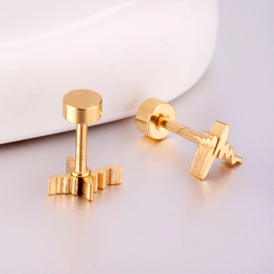Macro shot of gold heartbeat EKG stud earrings with minimalist flat screw back design