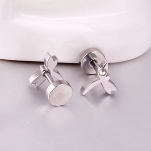 Detailed view of silver stainless steel dragonfly stud earrings with a clear cubic zirconia