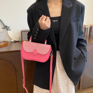 Pink contrast patchwork crossbody bag with textured flap and round silver trim