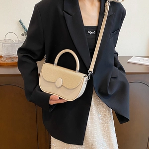 Chic beige crossbody bag featuring straw texture contrast stitching and round metal clasp