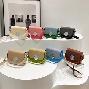 Modern color-block saddle bag with woven texture cover and round metal lock in 8 colors