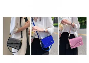 Detailed view of sparkly rhinestone crossbody bags with pearl straps in three colors