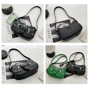 Macro detail of Y2K punk style shoulder bag with silver rivets and dual zipper features