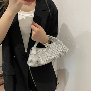 Sparkling silver rhinestone crescent handbag with top handle and elegant metal chain strap