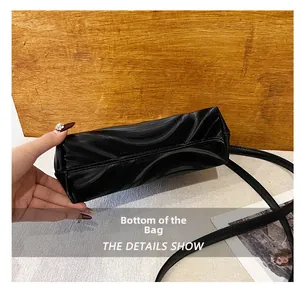 Close-up of shell bag bottom with elegant wavy texture and high-quality stitching