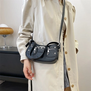 Chic black crescent rivet bag with silver hardware for punk and street style fashion