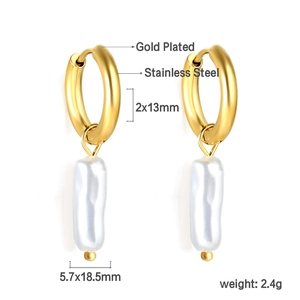 Detail of gold plated stainless steel hoop earrings with hanging white baroque pearls
