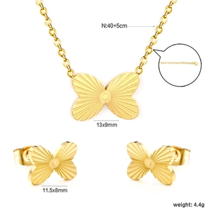 Golden butterfly jewelry set with engraved necklace and matching stud earrings