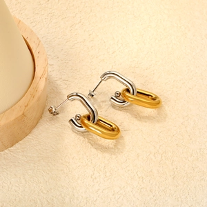 Modern geometric bicolor interlocking U-shape and oval stud earrings in gold and silver