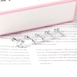 Detail of four pairs of round-cut cubic zirconia stud earrings in varied sizes
