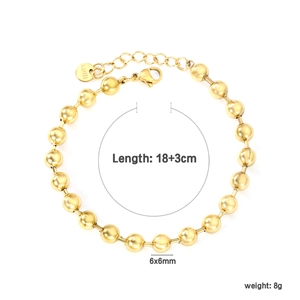 Detailed macro view of 6mm golden stainless steel beads with lobster clasp and chain