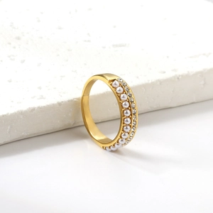 Macro shot of 18K gold plated stainless steel ring with white pearls and small zircons