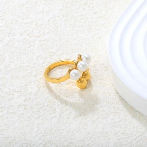Modern layered gold stainless steel ring with three white pearls and geometric beads