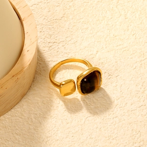 Gold open ring featuring square tiger eye stone and polished geometric metal accent