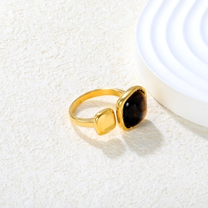 Adjustable gold stainless steel ring with square brown tiger eye stone on white base