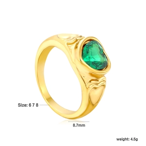 Detail of 18k gold plated ring with green heart gemstone and side heart embossing