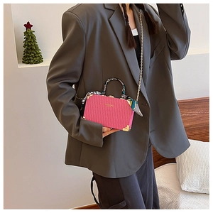 Pink vintage box bag with vertical stripes, gold metal corners and silk scarf handle