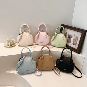 Retro doctor style crossbody handbag in six colors with top handle and fashion logo