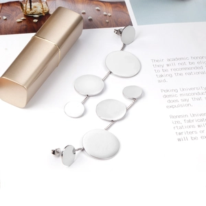 Minimalist stainless steel long drop earrings featuring silver geometric disc tassels