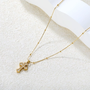Gold stainless steel cross necklace with inlaid zircons and beaded chain for women
