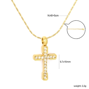 Detail of gold cross pendant with white zircon stones and size specifications