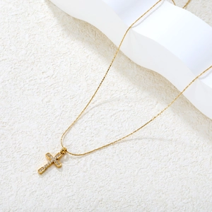 Elegant gold-plated stainless steel cross necklace for women featuring sparkling zircon stones