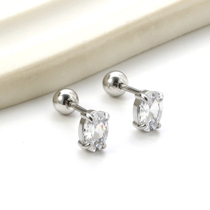 Detailed macro view of oval-cut zircon earrings with secure threaded ball backings