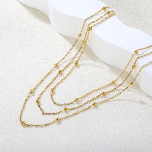 Elegante mehrlagige goldene Kugelkette für Damen mit minimalistisch poliertem Finish