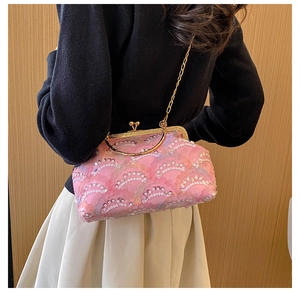 Detailed back view of pink sequin chain bag with floral mesh petals and gold clasp