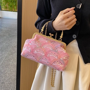 Sparkly pink sequin evening bag with gold floral handle and metal chain strap