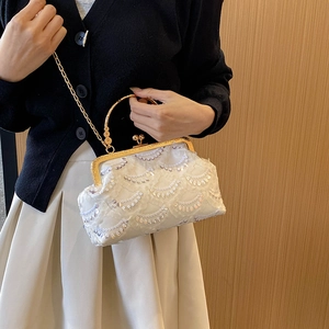 Sparkly sequin evening clutch bag with gold chain strap and metal ring handle for women