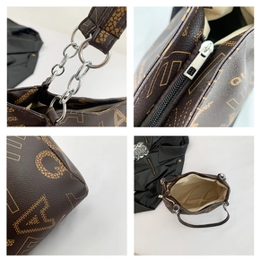 Detail view of silver chain, zipper closure, and inner lining of brown monogram tote bag