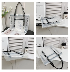 Close-up of transparent PVC tote bag with FASHION lettering and printed canvas handle