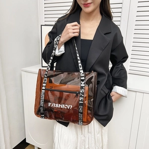 Brown transparent PVC tote bag with Fashion lettering and wide webbed shoulder strap