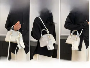 Three ways to wear a white crocodile pattern shell bag: handbag, shoulder, and crossbody