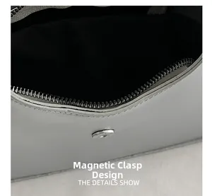 Detail showing the magnetic buckle closure and metal zipper of the bow shoulder bag