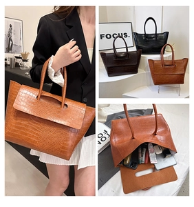 Detailed view of large capacity faux crocodile pattern tote bag showing interior storage space