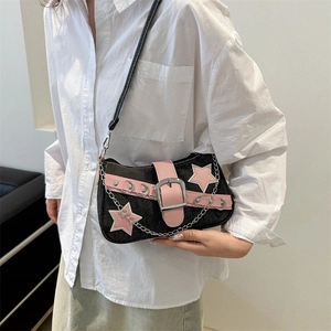 Y2K denim underarm bag with pink star patches and metallic chain detail on shoulder