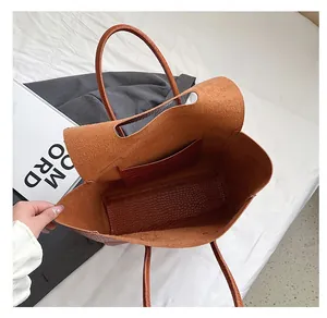 Top view of brown crocodile-embossed leather tote bag showing spacious inner compartment