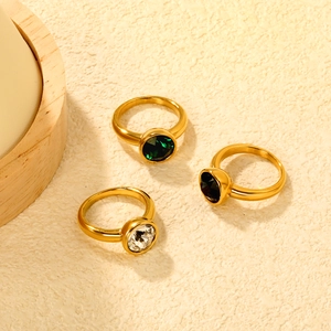 Three-piece stainless steel 18K gold ring set with emerald and round crystal gems