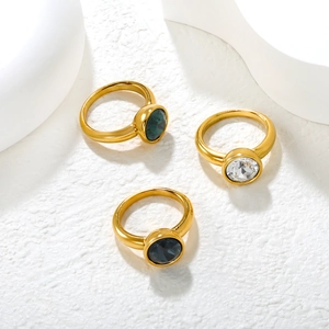 Three minimalist 18K gold plated stainless steel rings with round emerald-cut zircons