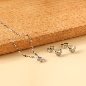 Minimalist butterfly necklace and stud earrings set in polished stainless steel for women
