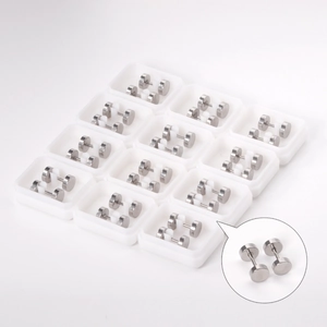 Bulk set of classic silver stainless steel round disc stud earrings on white trays