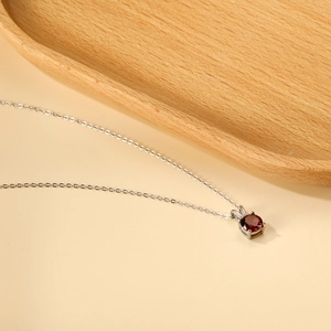 Minimalist stainless steel 18K gold necklace with red cubic zirconia pendant