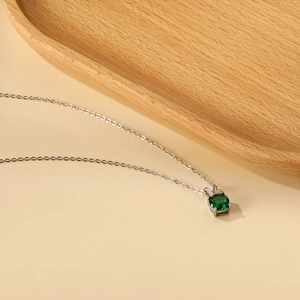 Minimalist 18K gold-plated stainless steel necklace with round green zircon pendant