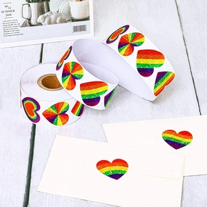 Rainbow heart stickers roll for Valentine gifts with glitter texture on white envelopes