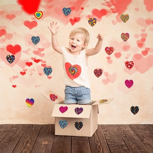 Colorful heart-shaped adhesive stickers for Valentine's gifts and DIY decoration on a box