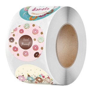 Roll of round colorful donut themed happy birthday stickers and treat yourself labels